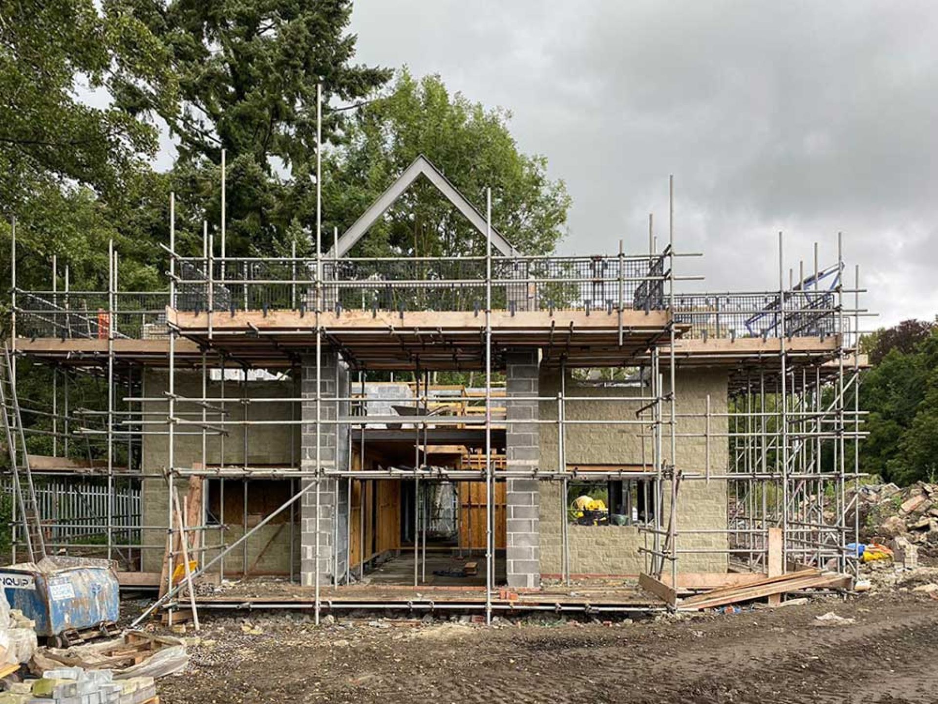 Construction progress of five bedroom manor house with walls built up and roof started.