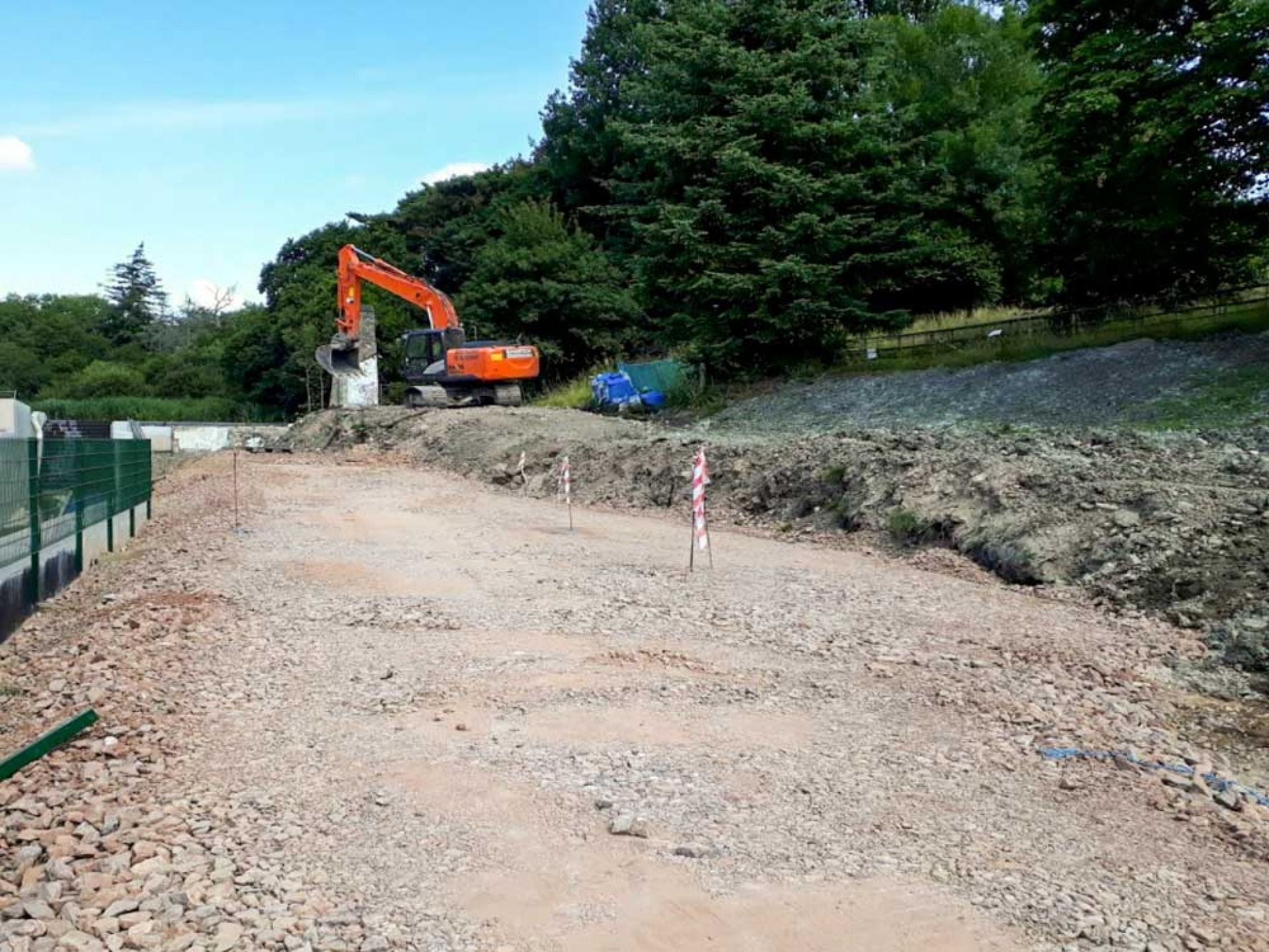 Large construction of highway being dug out.