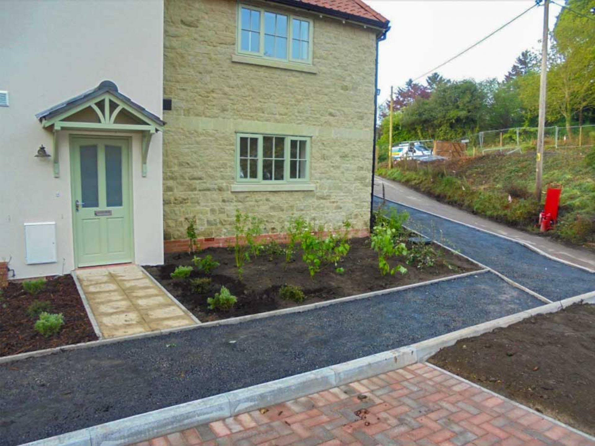 Close up of pathway running along new houses.