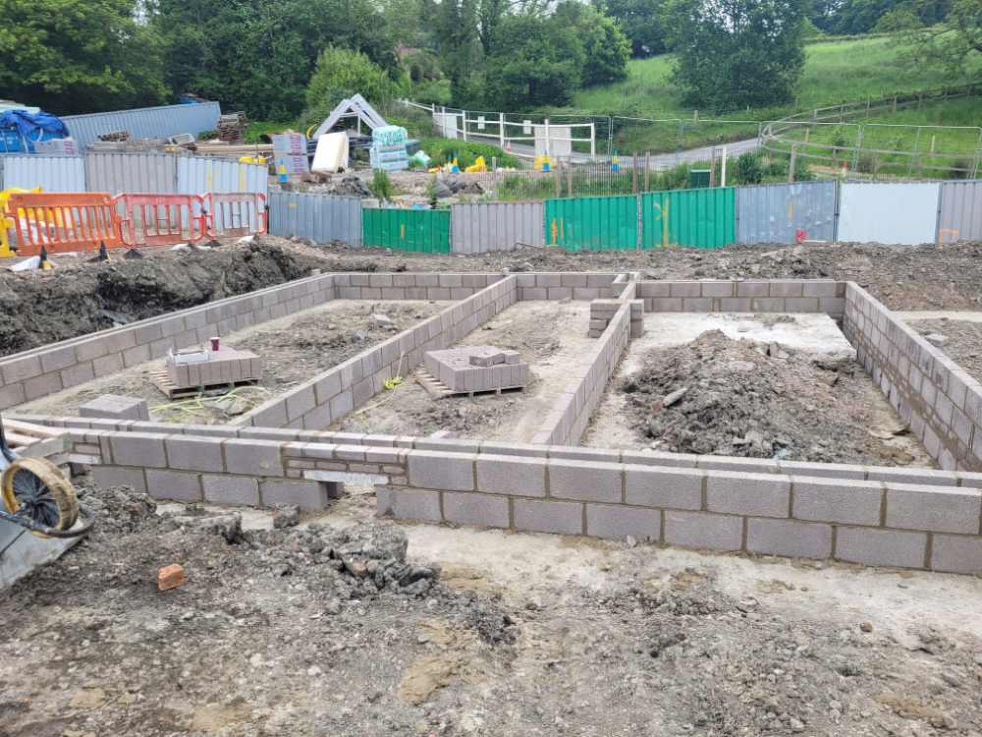 Early development of 5 townhouse with the brick foundations being put in place.