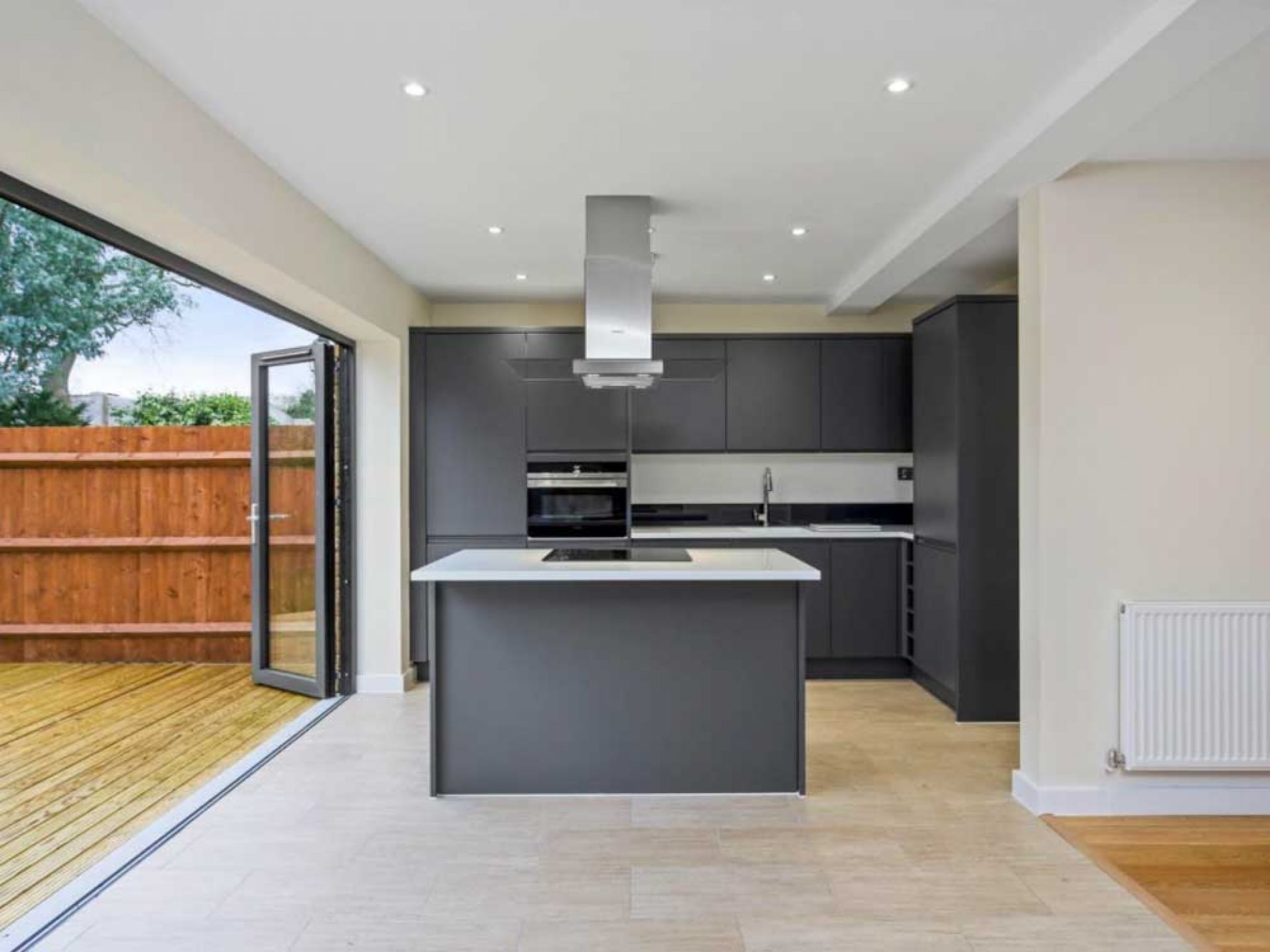 New construction dining area with secondary cooker leading out to the garden area.