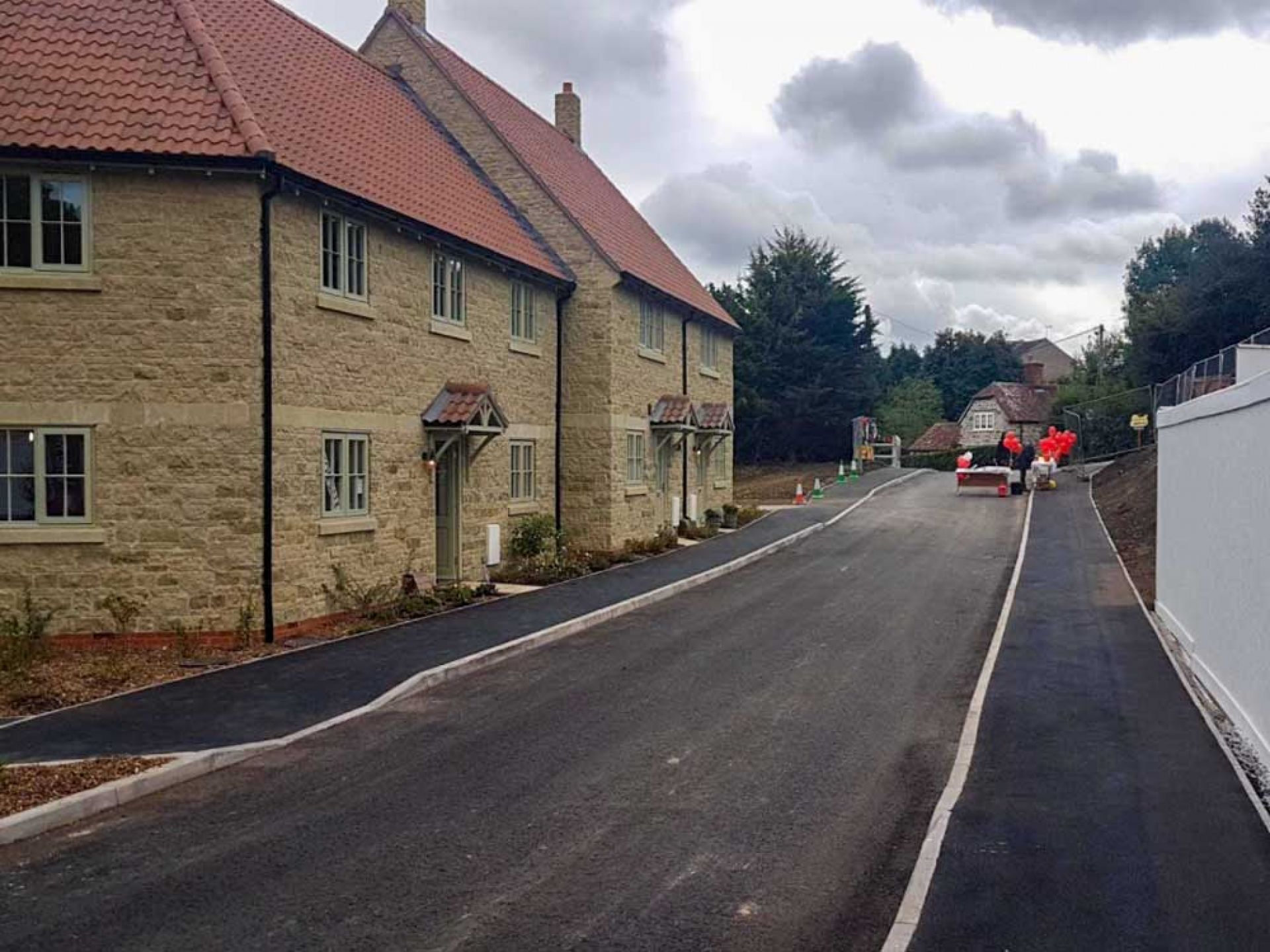 Completion of new highway past some new housing.