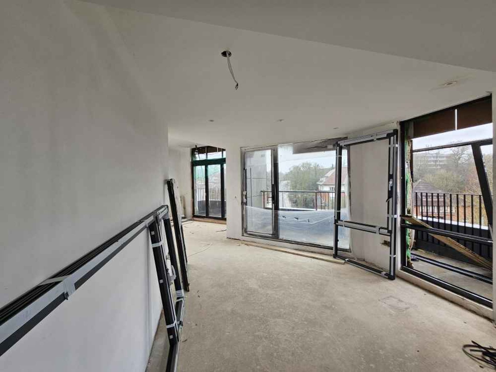 Flat development in london from the inside. Windows installed in a large hallway.